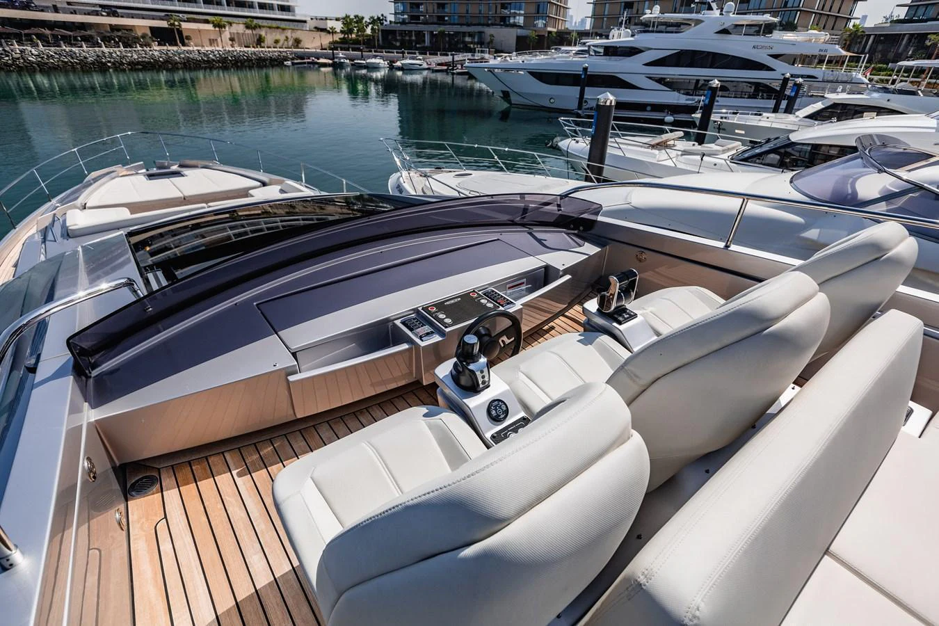 The yacht's helm offers a sleek and modern design with comfortable seating and advanced controls. aboard 2021 PERSHING 8X Yacht for Sale