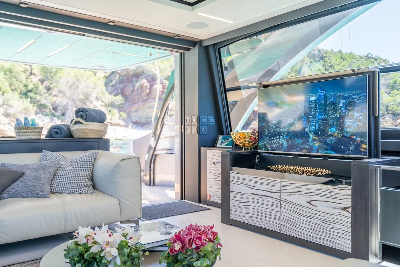 The salon offers a luxurious and comfortable space with a large TV and scenic views. aboard DESERT STAR Yacht for Sale