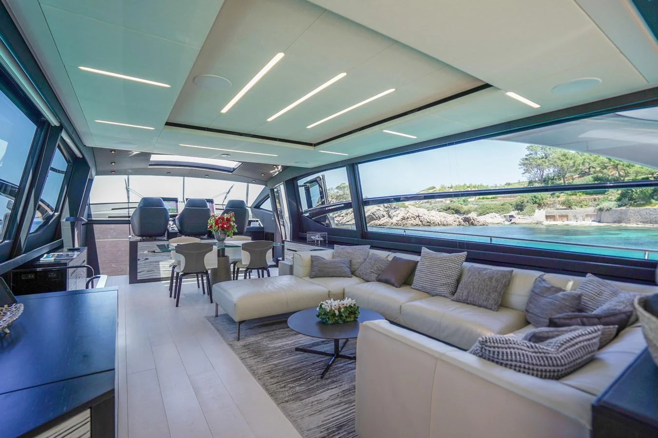 The spacious salon offers panoramic views and luxurious seating arrangements. aboard DESERT STAR Yacht for Sale