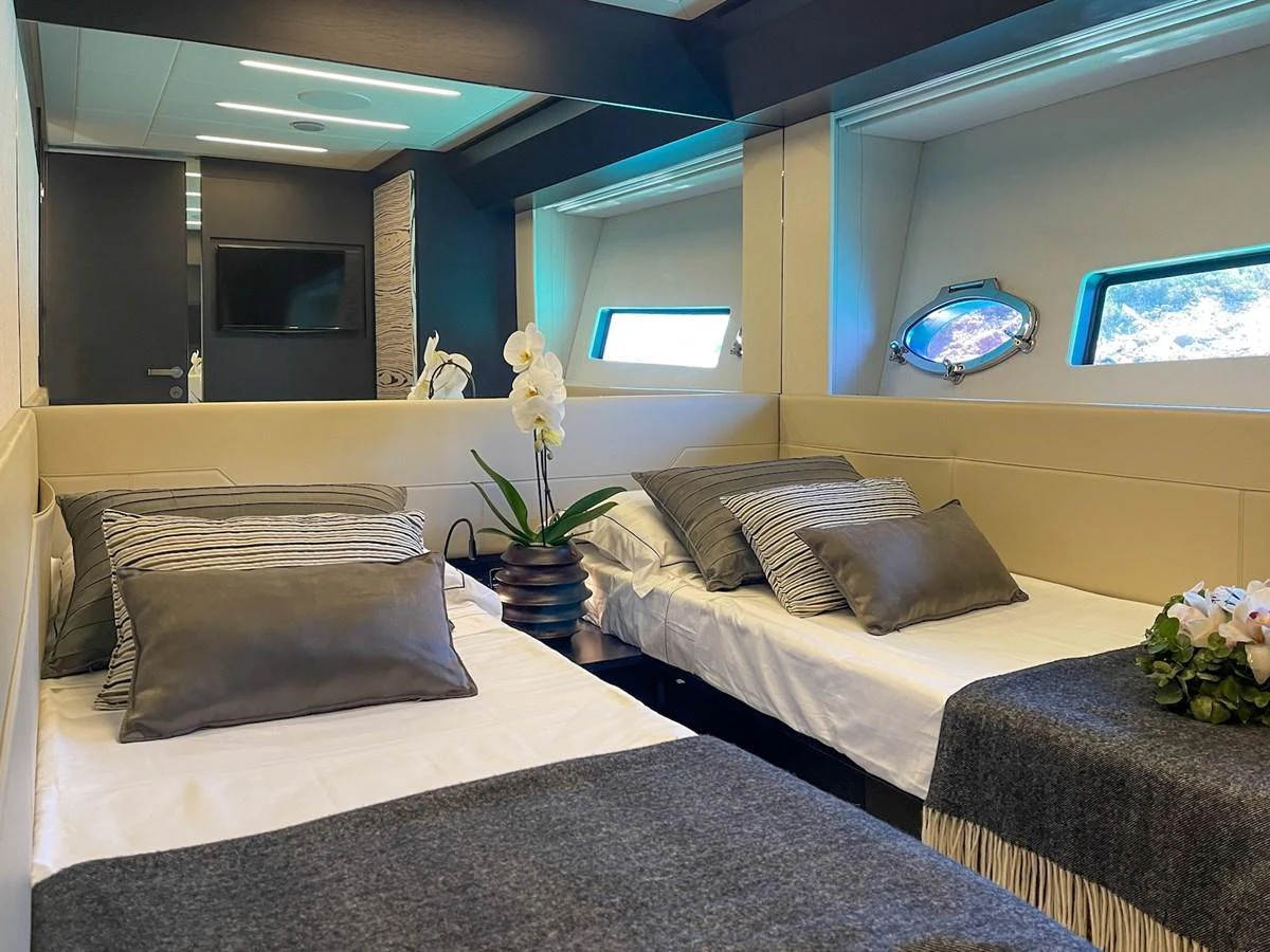 The twin stateroom offers a cozy and elegant retreat with modern decor and ample natural light. aboard DESERT STAR Yacht for Sale
