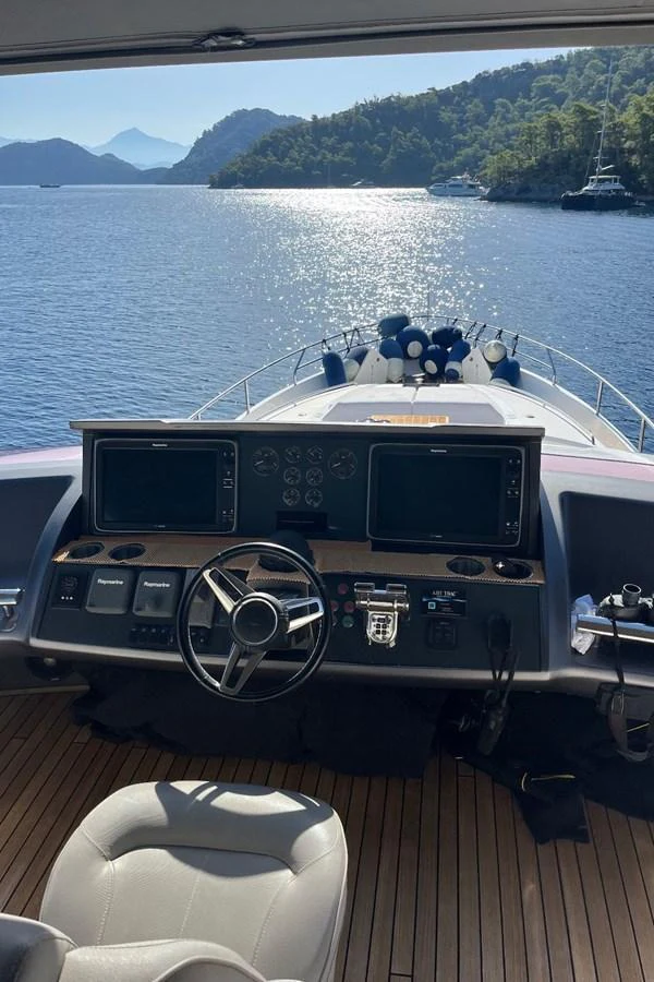 The helm station offers a commanding view of the serene waters and surrounding landscape. aboard MS FELICE Yacht for Sale