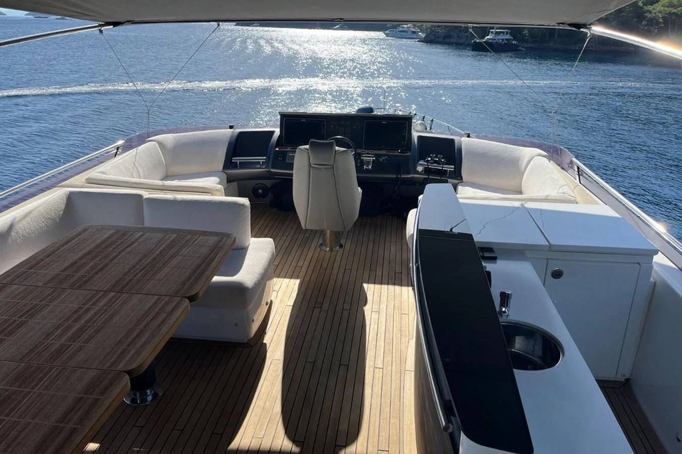 The flybridge offers a spacious and luxurious area with ample seating and a well-equipped helm station. aboard MS FELICE Yacht for Sale