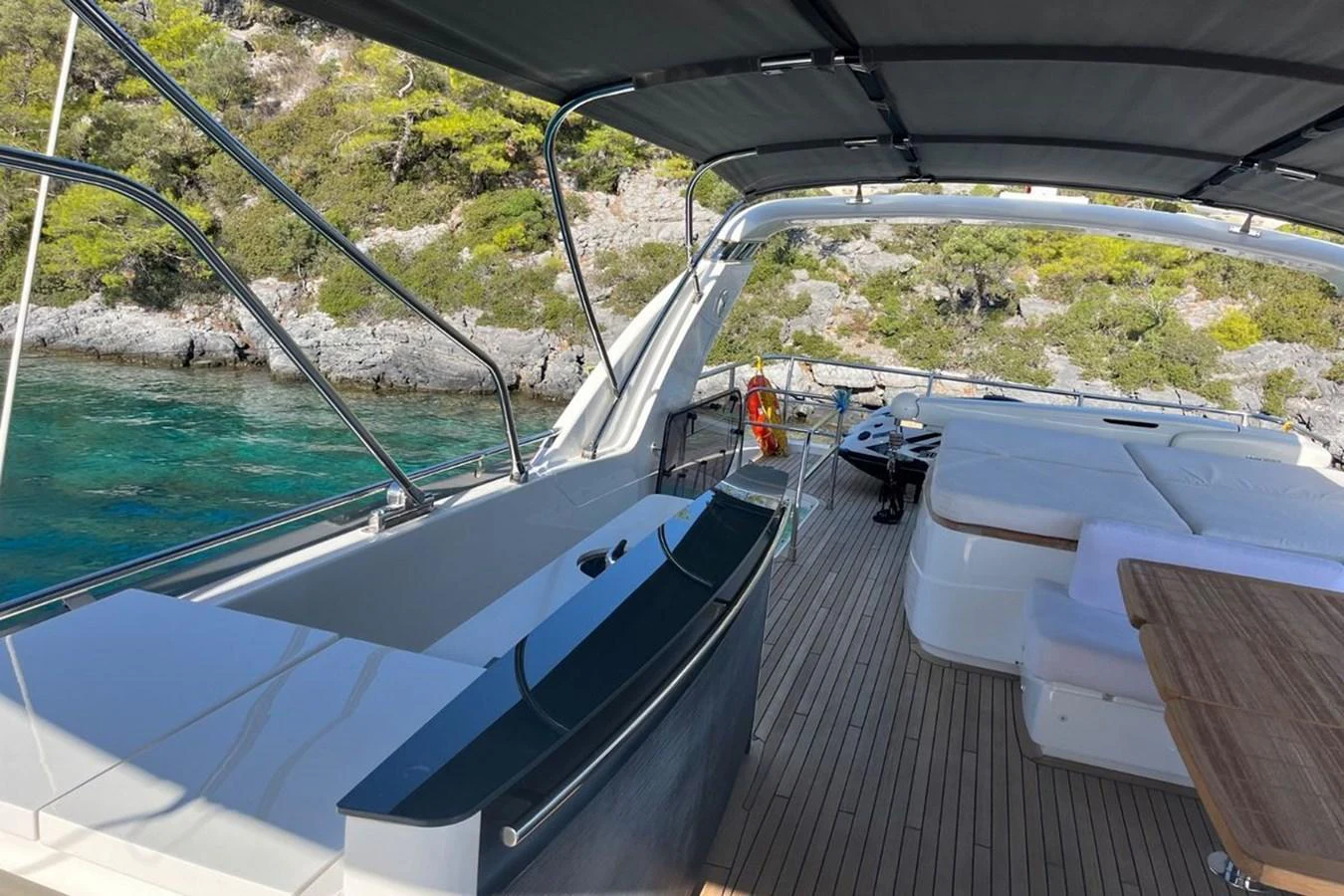 The flybridge offers a spacious and shaded area for relaxation and dining with scenic views. aboard MS FELICE Yacht for Sale
