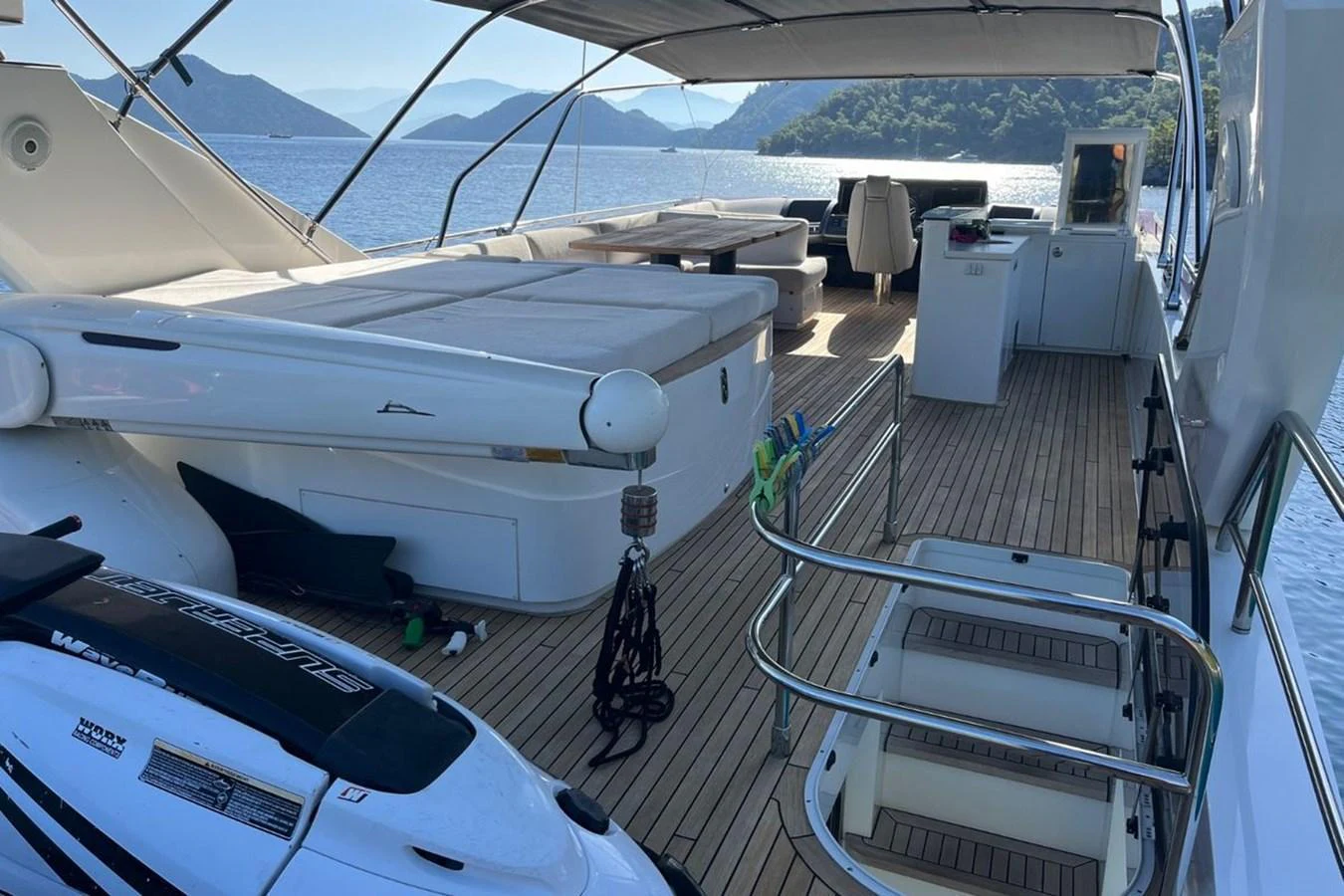 The aft deck features a spacious lounging area with ample seating and stunning views of the surrounding waters. aboard MS FELICE Yacht for Sale