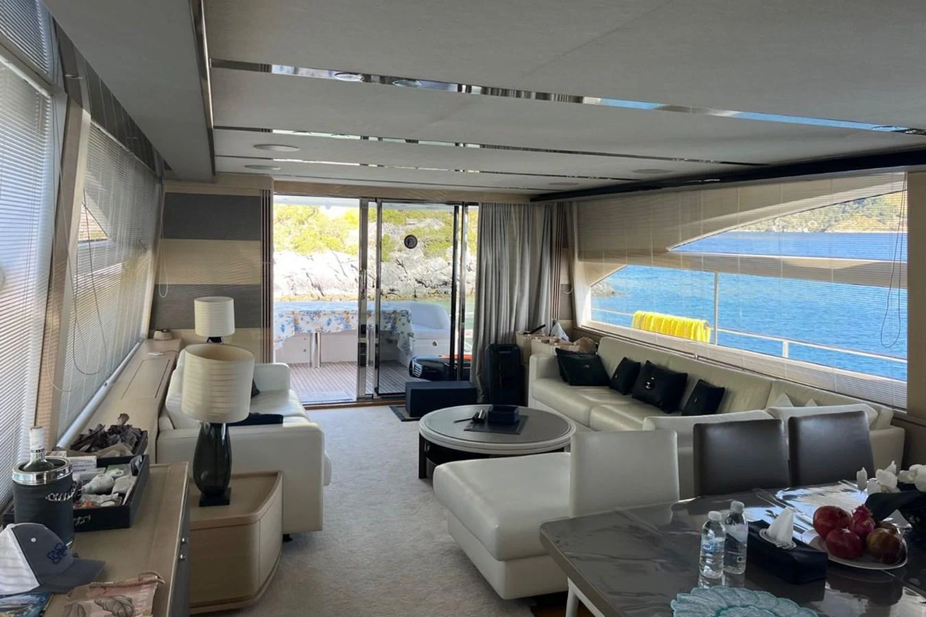 The yacht's salon offers a spacious and luxurious seating area with large windows providing stunning ocean views. aboard MS FELICE Yacht for Sale