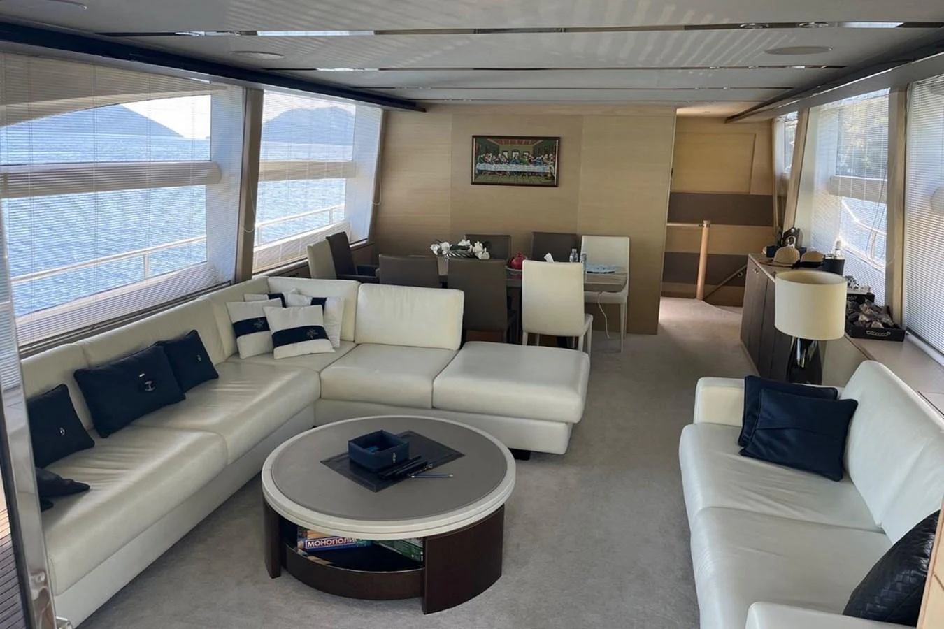 The yacht's salon features a spacious and elegant seating area with large windows offering stunning sea views. aboard MS FELICE Yacht for Sale
