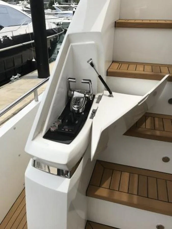 The image showcases a detailed view of a yacht's control panel integrated into the staircase area. aboard ANDAMAN PRINCESS Yacht for Sale