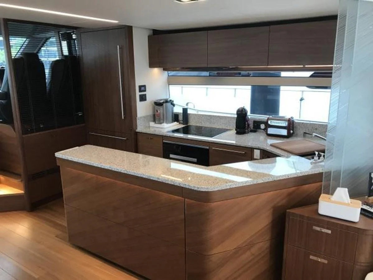 The yacht's galley features modern appliances and sleek wooden cabinetry. aboard ANDAMAN PRINCESS Yacht for Sale