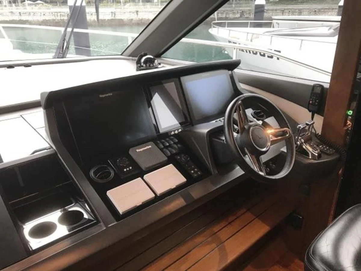 The helm station features advanced navigation equipment and a sleek steering wheel, offering a commanding view for the captain. aboard ANDAMAN PRINCESS Yacht for Sale