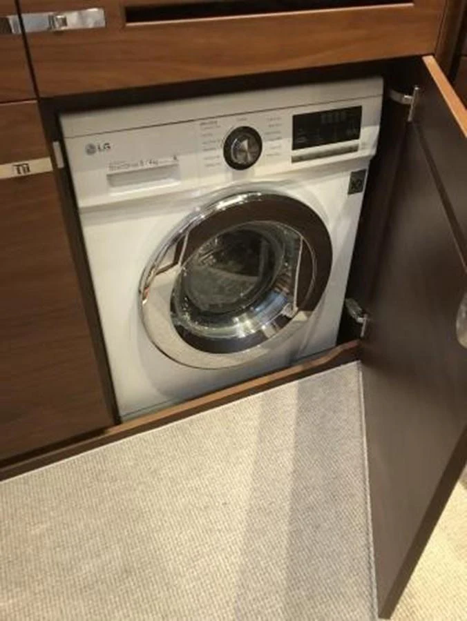A built-in washing machine is neatly integrated into the yacht's cabinetry. aboard ANDAMAN PRINCESS Yacht for Sale