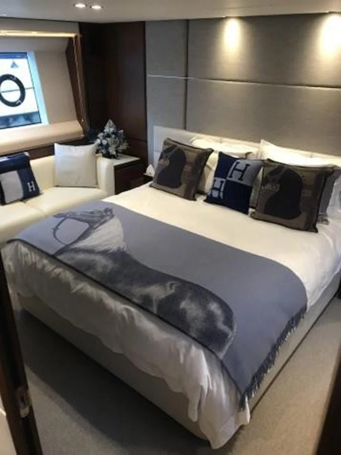 A luxurious stateroom featuring a plush bed with elegant bedding and tasteful decor. aboard ANDAMAN PRINCESS Yacht for Sale
