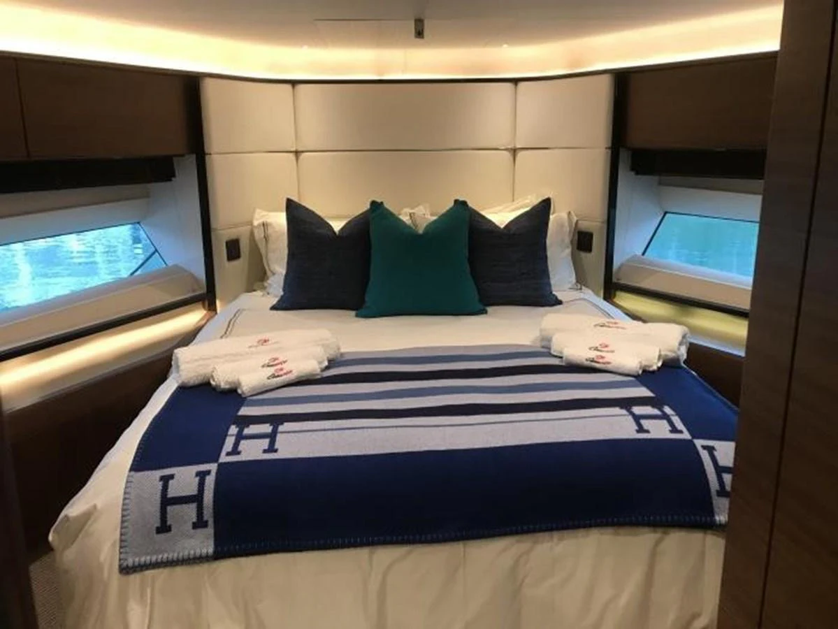 A luxurious stateroom featuring a comfortable bed with elegant bedding and ambient lighting. aboard ANDAMAN PRINCESS Yacht for Sale
