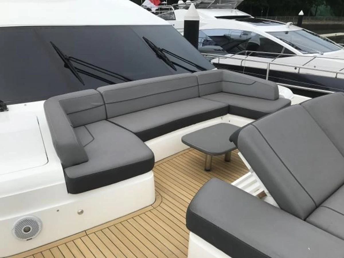 The yacht's aft deck features a comfortable seating area with sleek, modern cushions and a small table, perfect for relaxation. aboard ANDAMAN PRINCESS Yacht for Sale