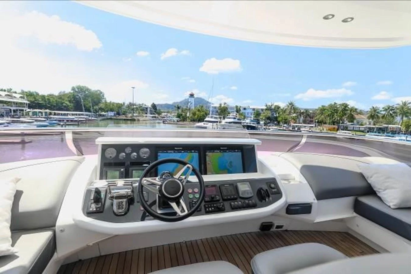 The helm station offers a panoramic view with advanced navigation equipment and comfortable seating. aboard ANDAMAN PRINCESS Yacht for Sale
