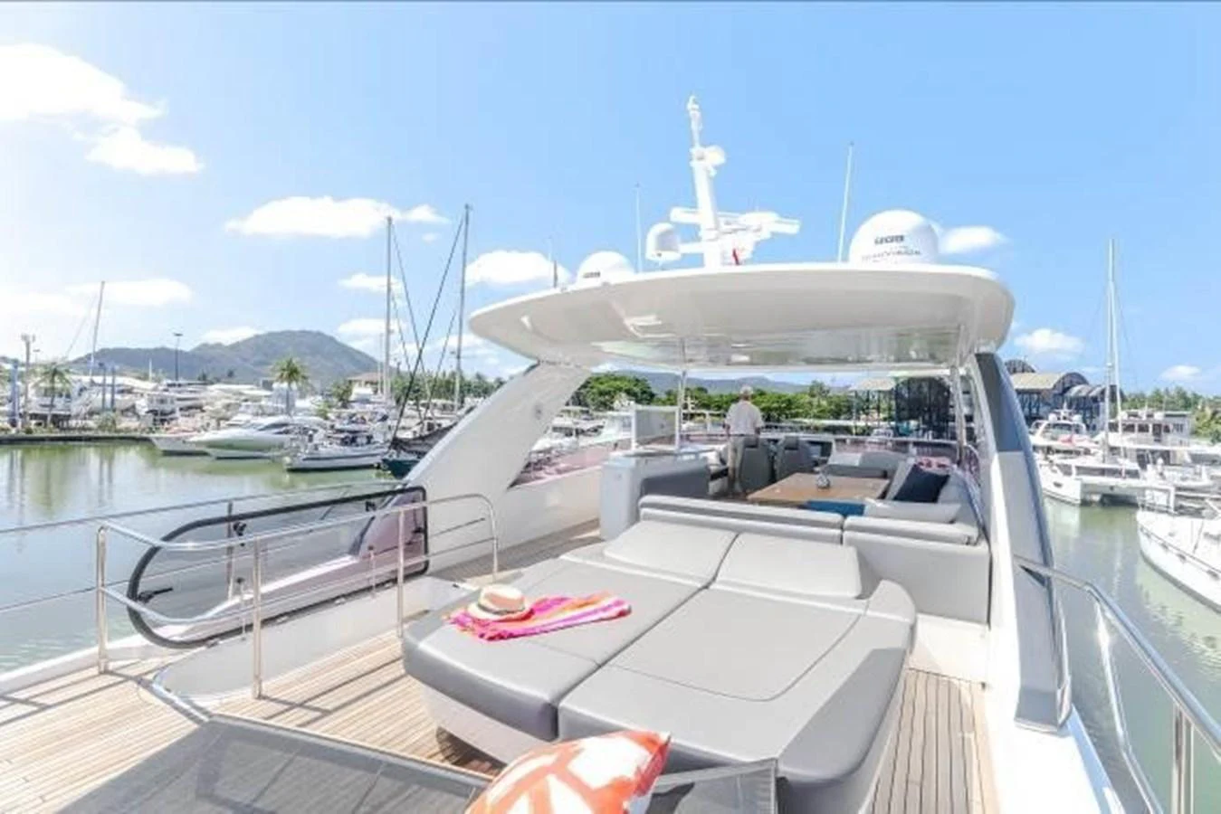 The flybridge offers a spacious lounging area with comfortable seating and scenic marina views. aboard ANDAMAN PRINCESS Yacht for Sale