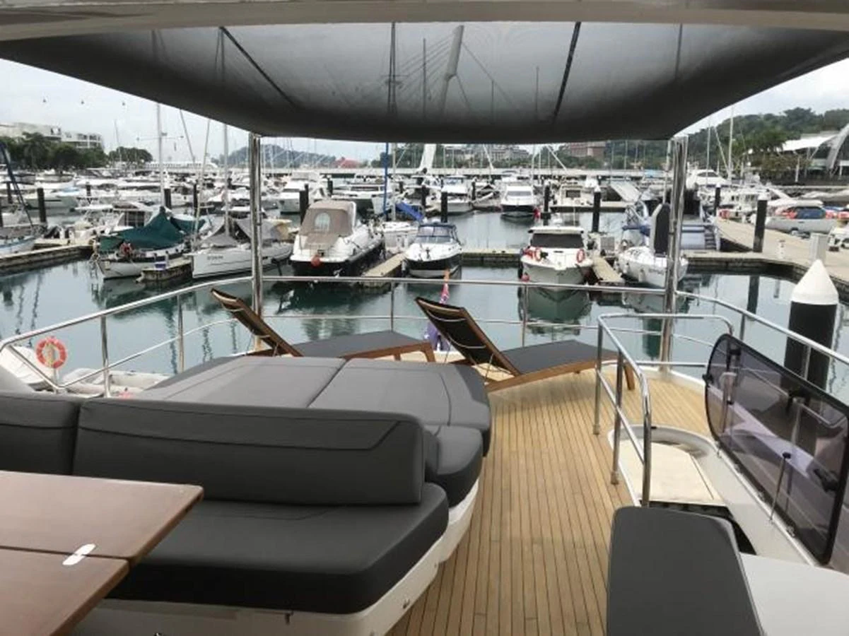 The aft deck offers a spacious lounging area with comfortable seating and a view of the marina. aboard ANDAMAN PRINCESS Yacht for Sale
