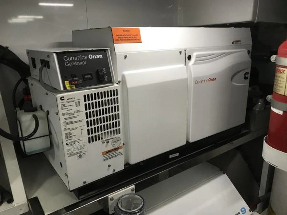 The image shows a Cummins Onan generator installed within the yacht's engine room. aboard ANDAMAN PRINCESS Yacht for Sale