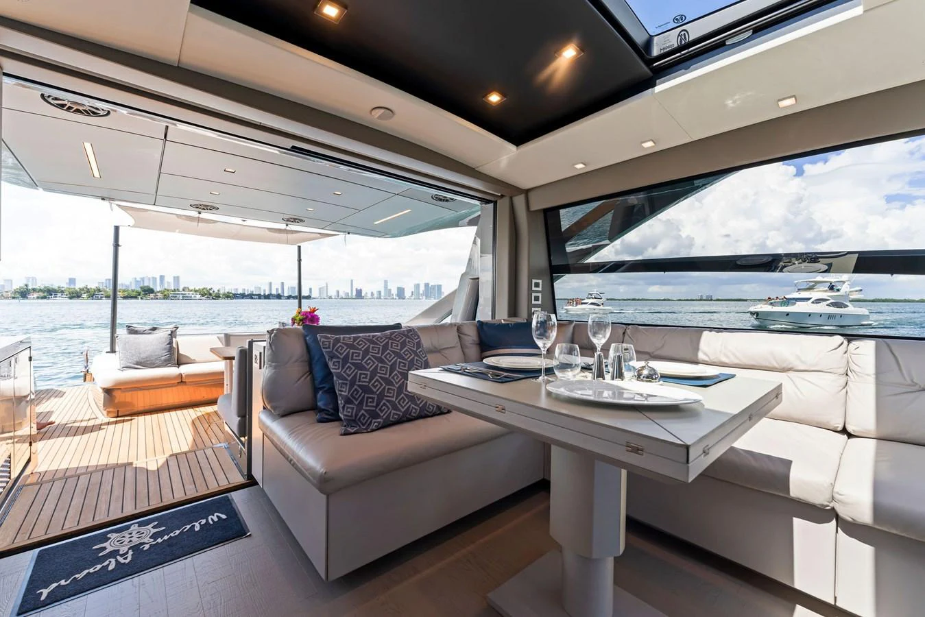 The salon offers a comfortable dining area with a view of the water. aboard QUANTUM Yacht for Sale