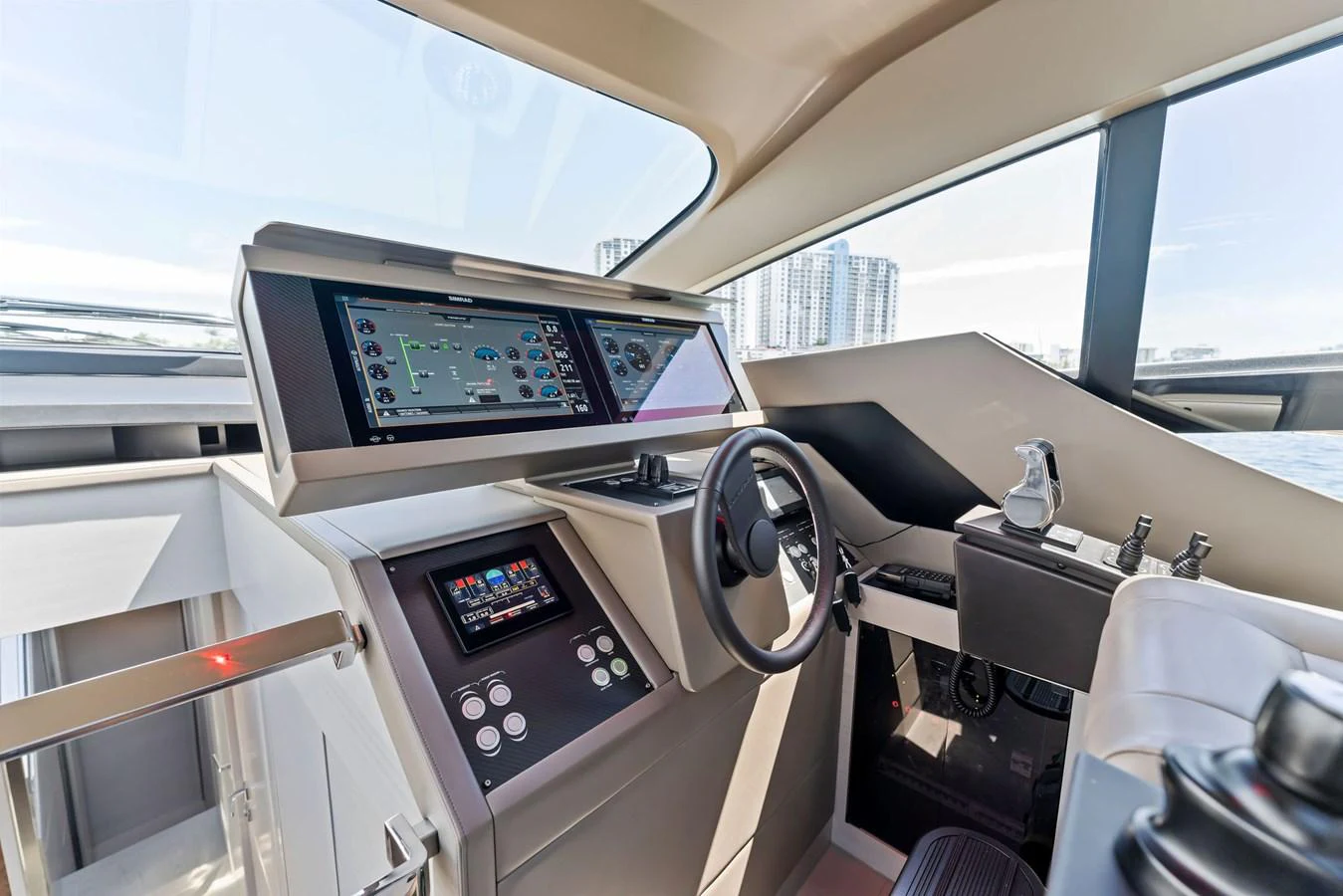The helm station features advanced navigation equipment and a sleek design. aboard QUANTUM Yacht for Sale