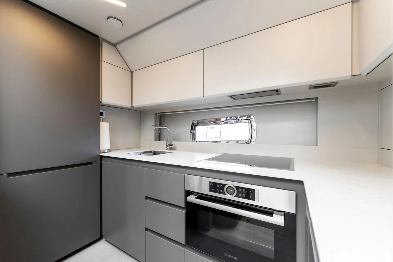 The modern galley features sleek cabinetry and high-end appliances. aboard QUANTUM Yacht for Sale