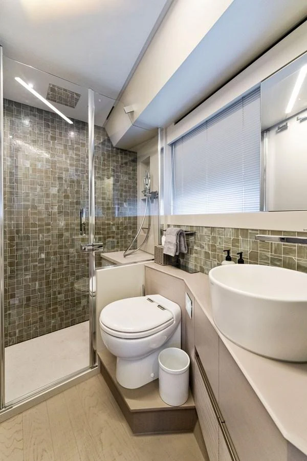 The yacht's bathroom features modern fixtures and a spacious shower area. aboard QUANTUM Yacht for Sale