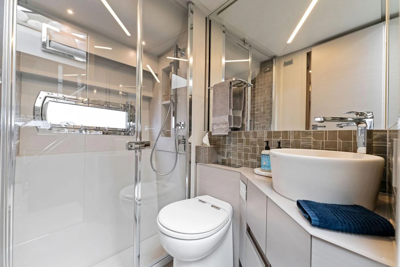 The yacht's bathroom features modern fixtures and a sleek design. aboard QUANTUM Yacht for Sale