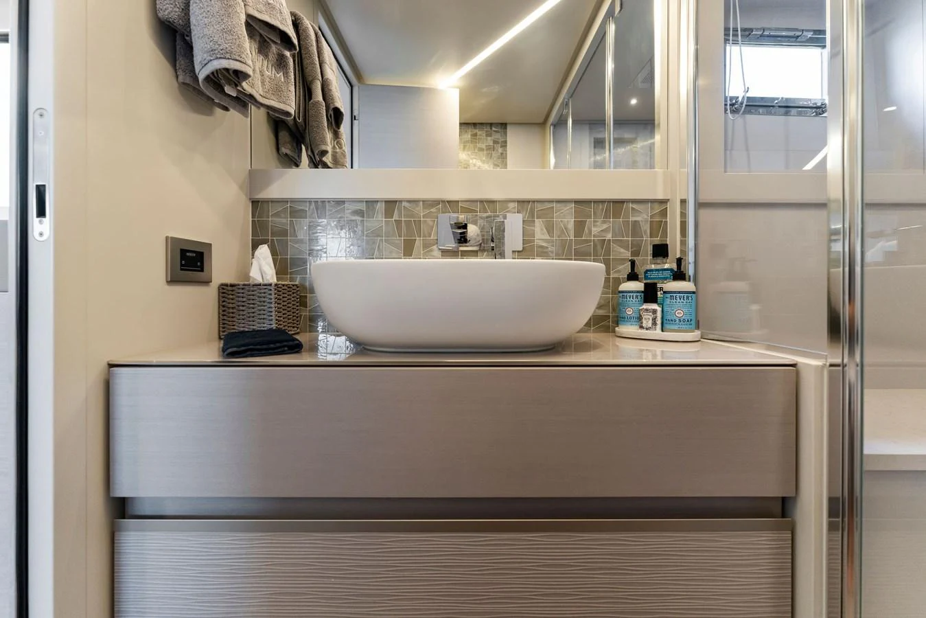 The yacht's bathroom features a modern sink and stylish decor. aboard QUANTUM Yacht for Sale