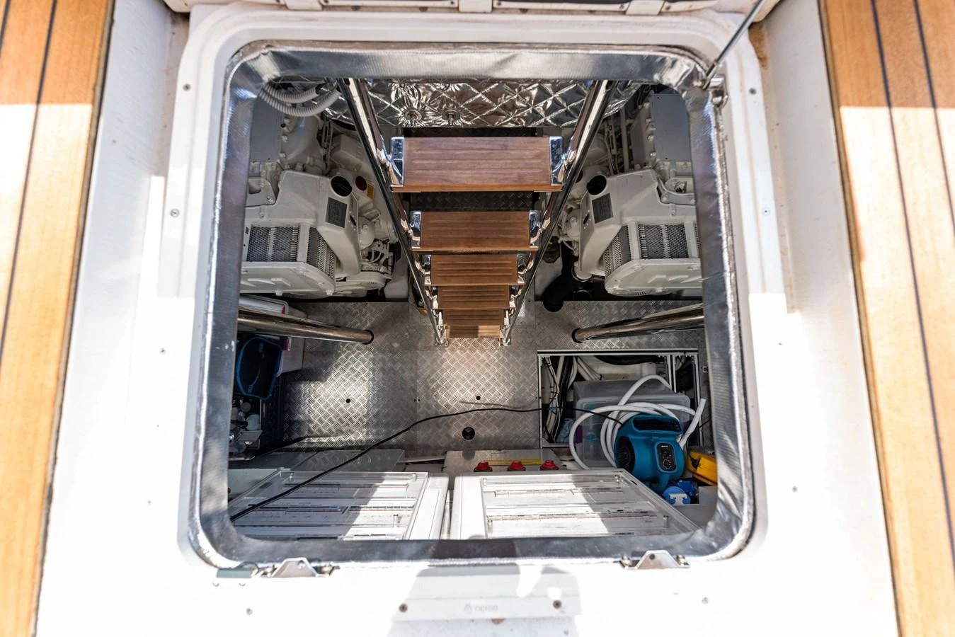 A view into the engine room showcasing the yacht's mechanical systems and access ladder. aboard QUANTUM Yacht for Sale