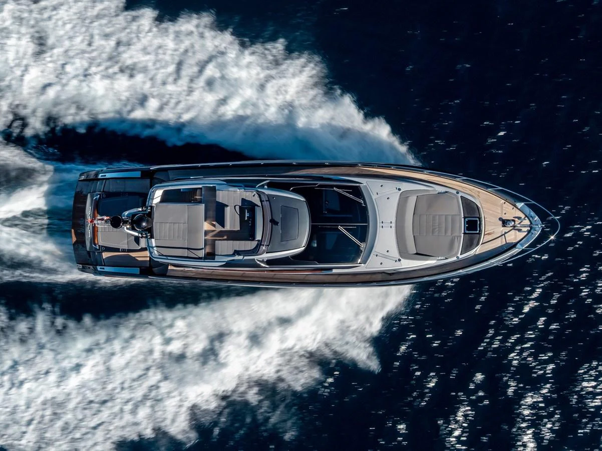 A sleek yacht glides swiftly through the water, leaving a trail of white wake behind. aboard AMELIA Yacht for Sale