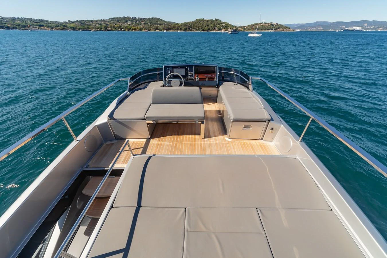 The foredeck features ample sunbathing space with luxurious cushions and stunning views of the surrounding waters. aboard AMELIA Yacht for Sale