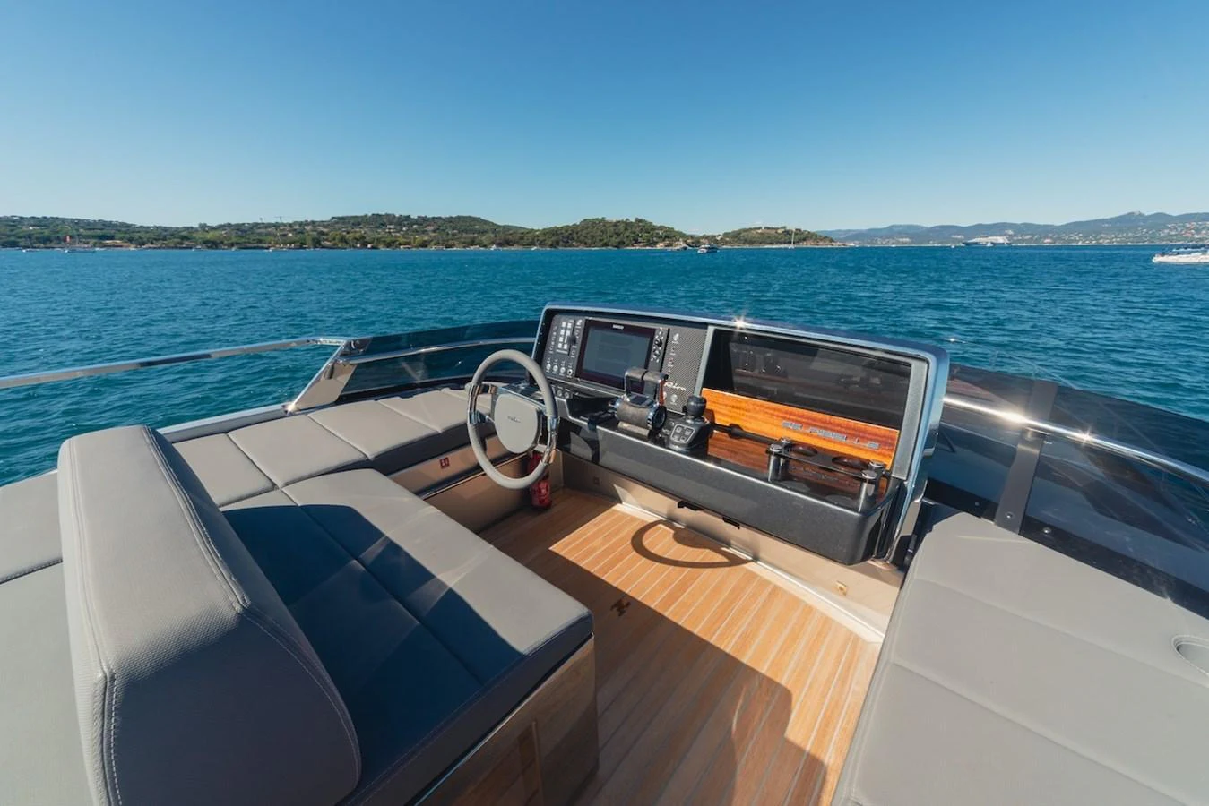 The helm station offers a commanding view with modern navigation equipment and comfortable seating. aboard AMELIA Yacht for Sale