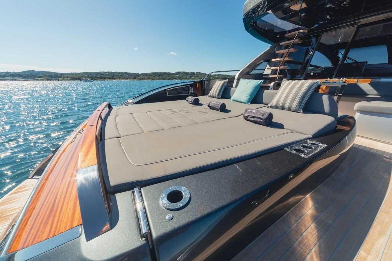 The foredeck features a spacious sunpad with plush cushions, perfect for relaxation under the sun. aboard AMELIA Yacht for Sale