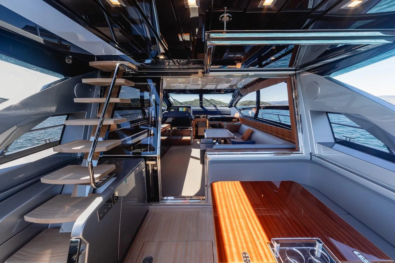 The yacht's salon features modern furnishings and expansive windows for a luxurious and open feel. aboard AMELIA Yacht for Sale