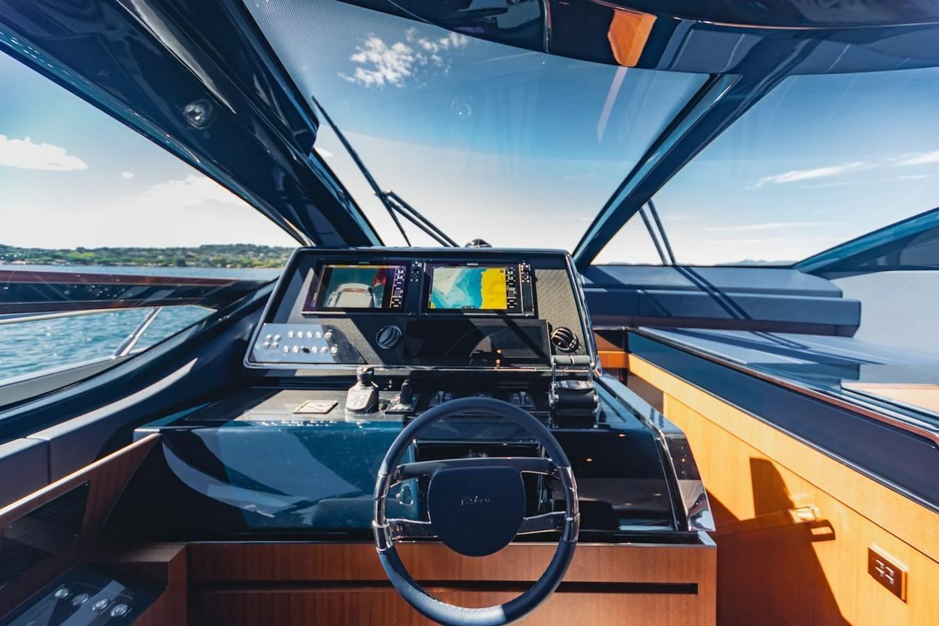 The helm station offers a sleek and modern design with advanced navigation equipment and panoramic views. aboard AMELIA Yacht for Sale