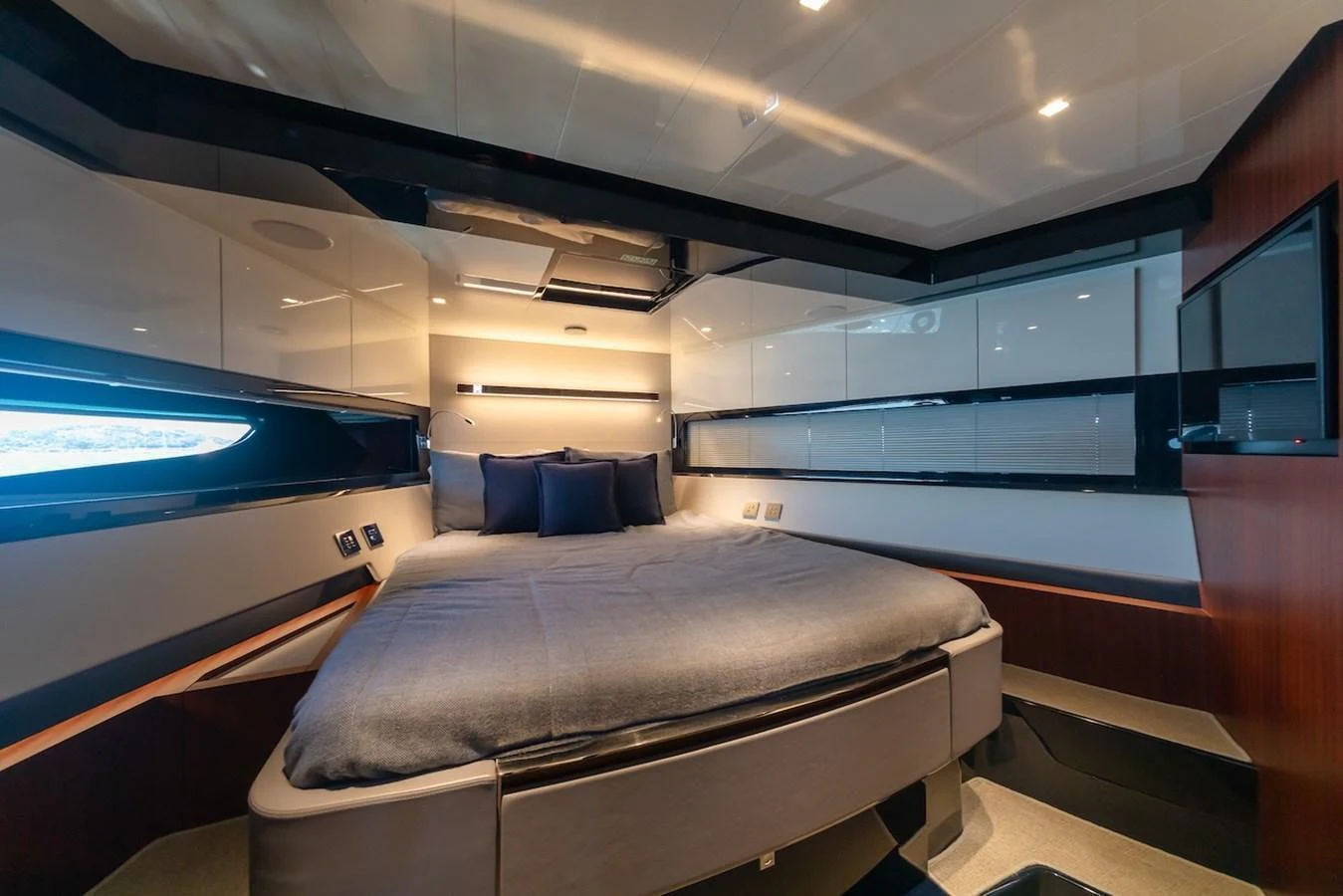 A luxurious stateroom featuring a large, comfortable bed and modern design elements. aboard AMELIA Yacht for Sale