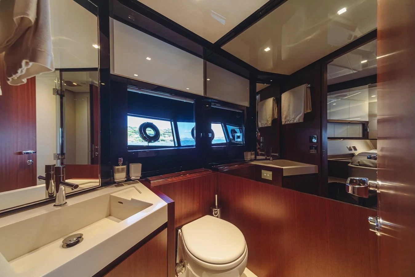 The yacht's bathroom features modern fixtures and a sleek design with ample natural light. aboard AMELIA Yacht for Sale