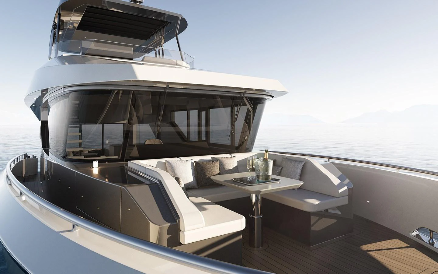 The yacht's aft deck features a stylish seating area with a table, perfect for relaxing and enjoying the view. aboard TBD Yacht for Sale