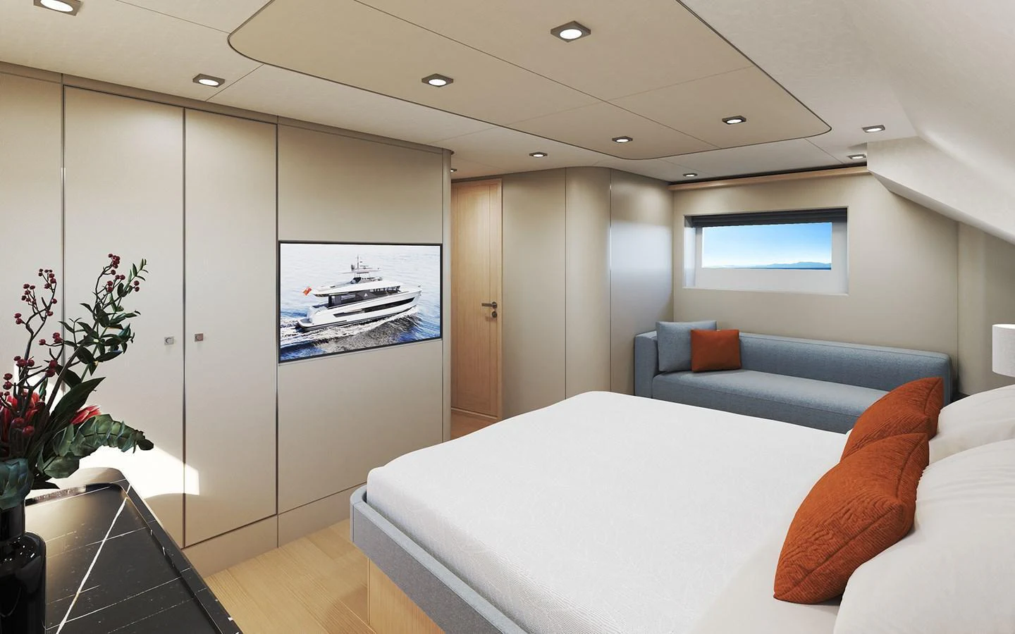 A luxurious stateroom featuring a comfortable bed, seating area, and a view of the sea. aboard TBD Yacht for Sale