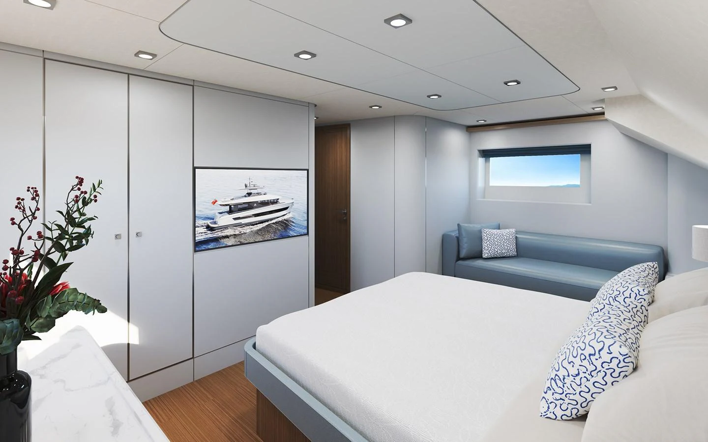 The stateroom features a comfortable bed, a sleek sofa, and a large window for natural light. aboard TBD Yacht for Sale