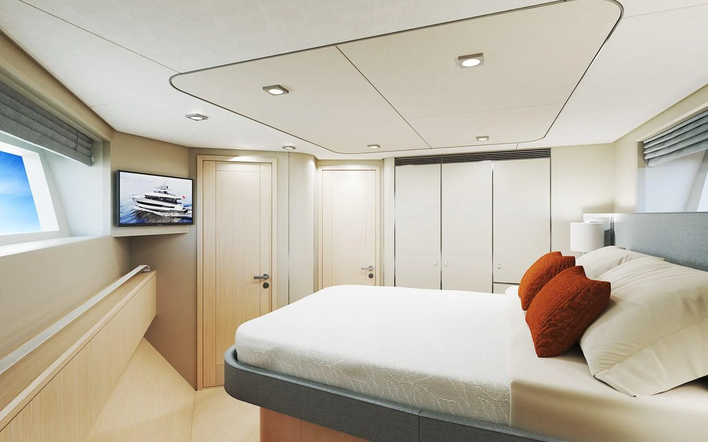 A luxurious stateroom featuring a large bed, modern decor, and ample natural light. aboard TBD Yacht for Sale