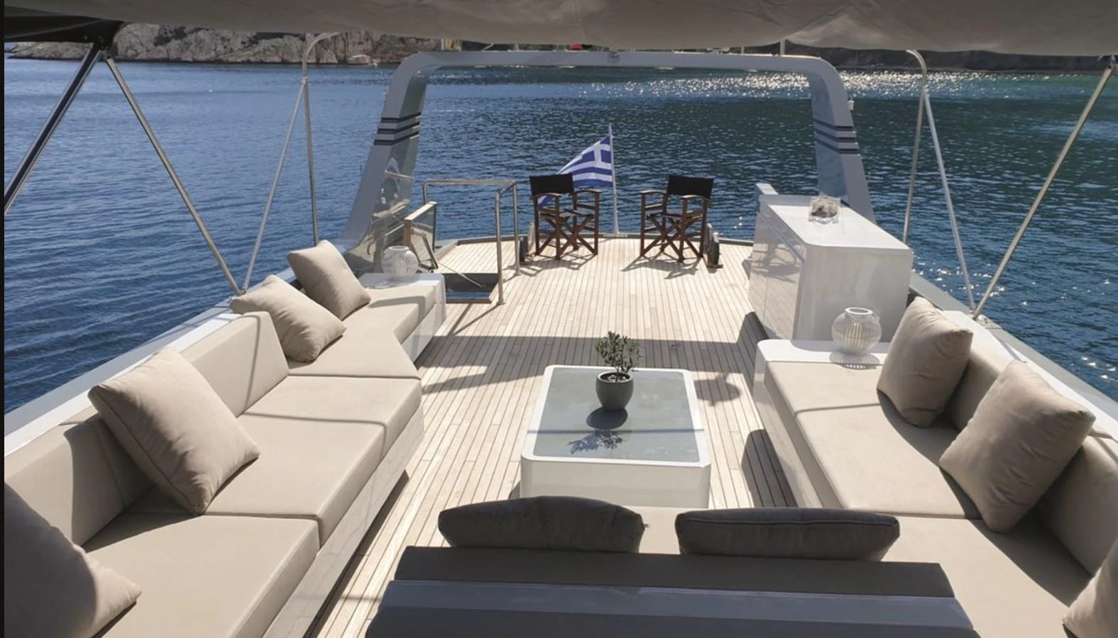 The aft deck offers a luxurious lounging area with comfortable seating and a stunning view of the water. aboard KISS Yacht for Sale