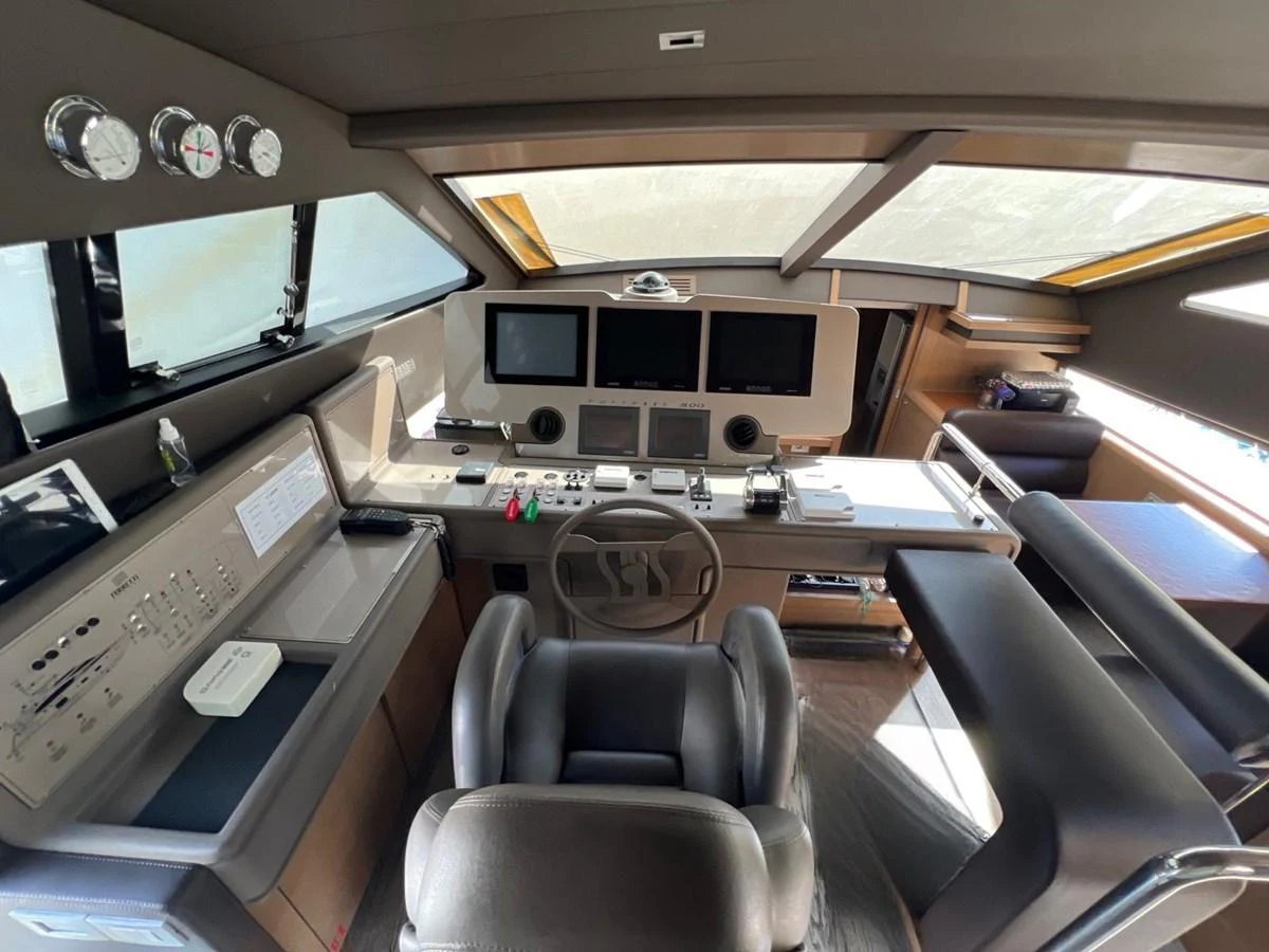 a room with a desk and chairs aboard NGV Yacht for Sale