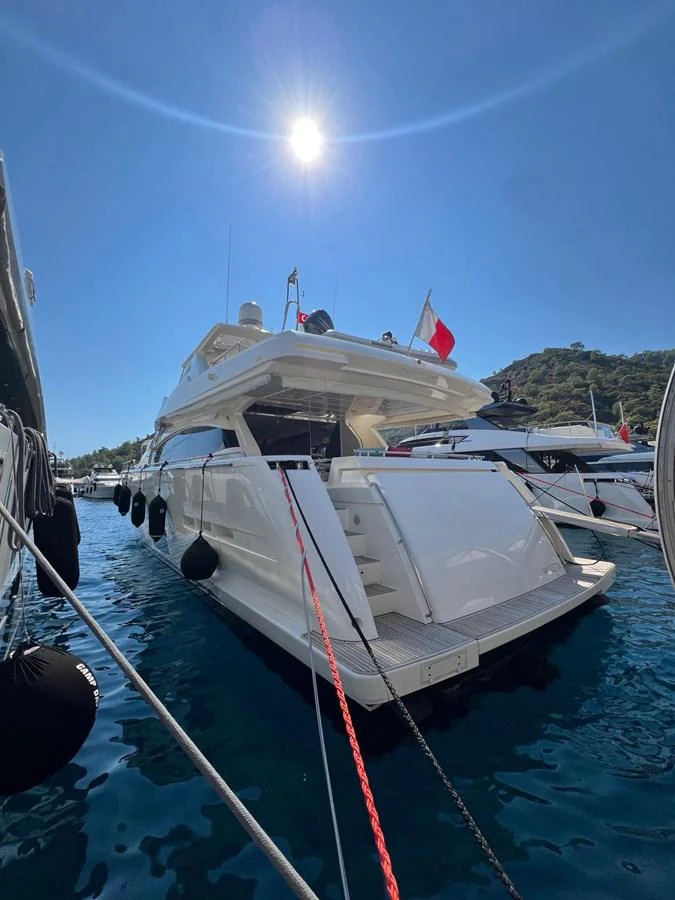 a boat docked at a pier aboard NGV Yacht for Sale