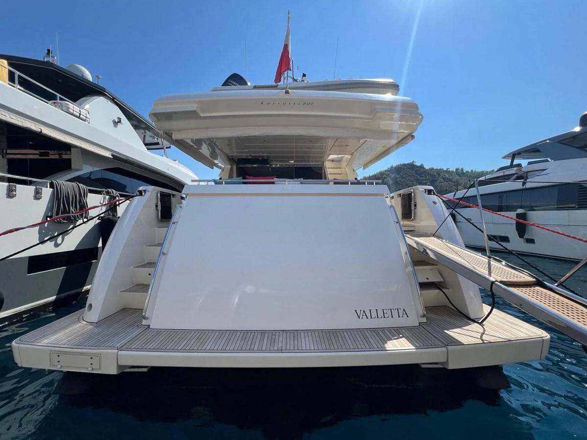 a boat docked at a pier aboard NGV Yacht for Sale