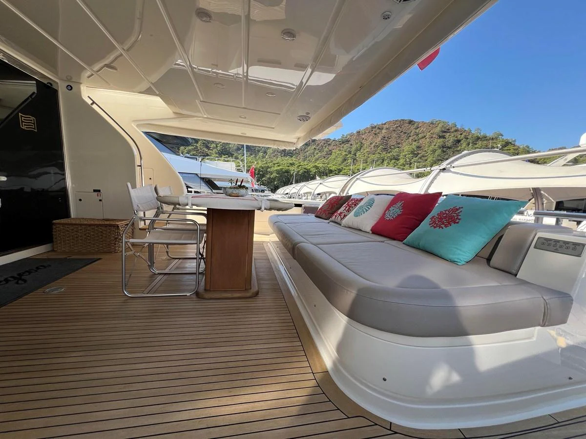 a tent with a deck and chairs aboard NGV Yacht for Sale
