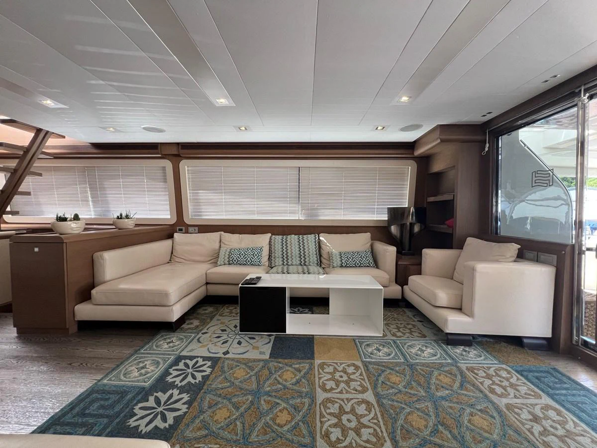 a living room with a large rug aboard NGV Yacht for Sale
