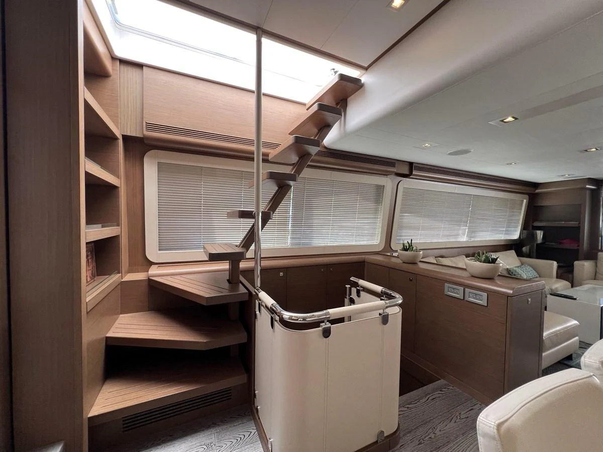 a room with a ladder and shelves aboard NGV Yacht for Sale