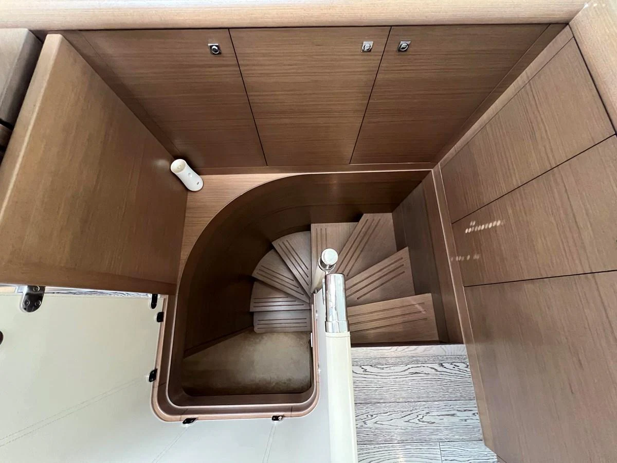 a wooden cabinet with a white handle aboard NGV Yacht for Sale