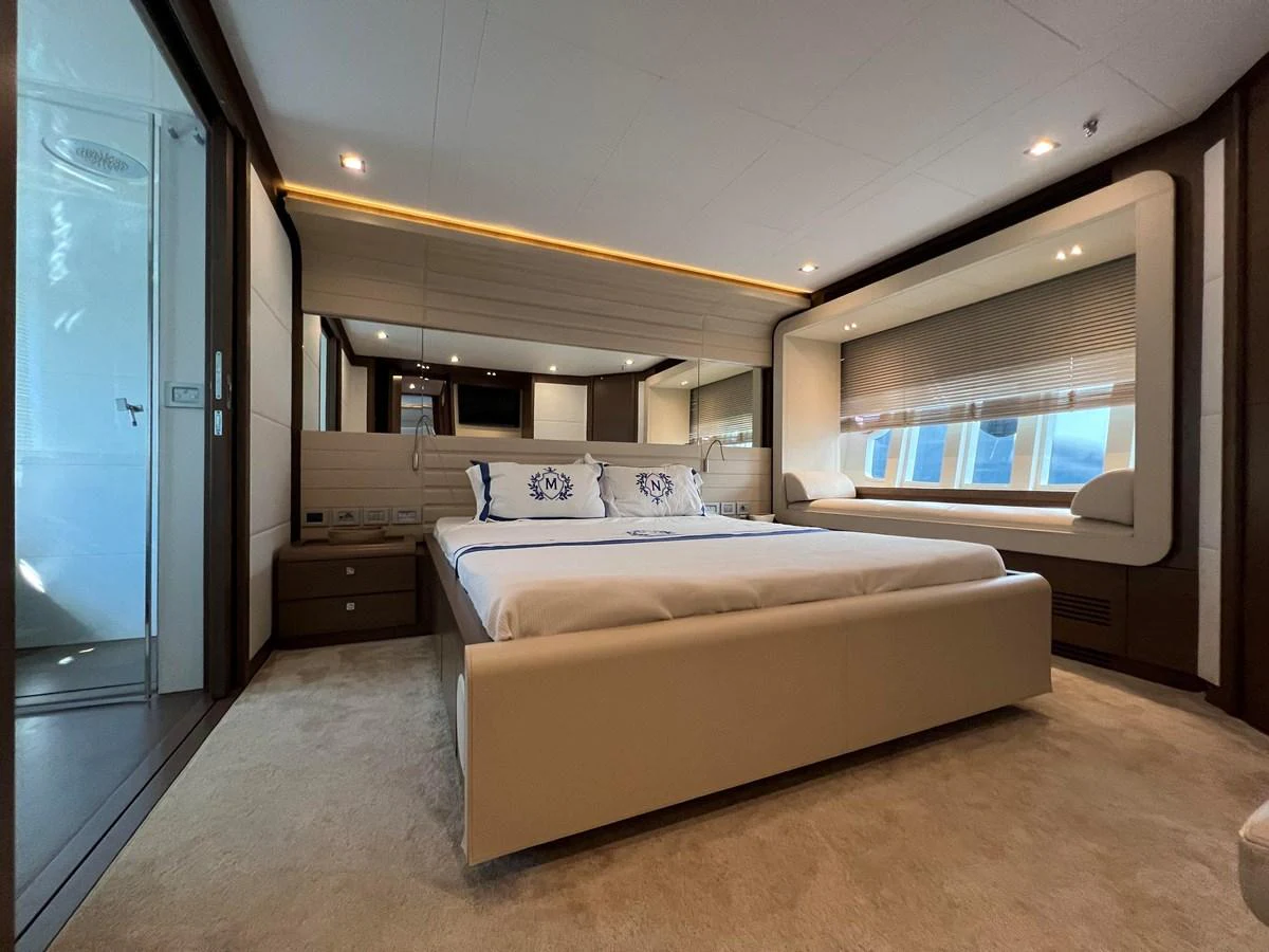 a bedroom with a bed aboard NGV Yacht for Sale