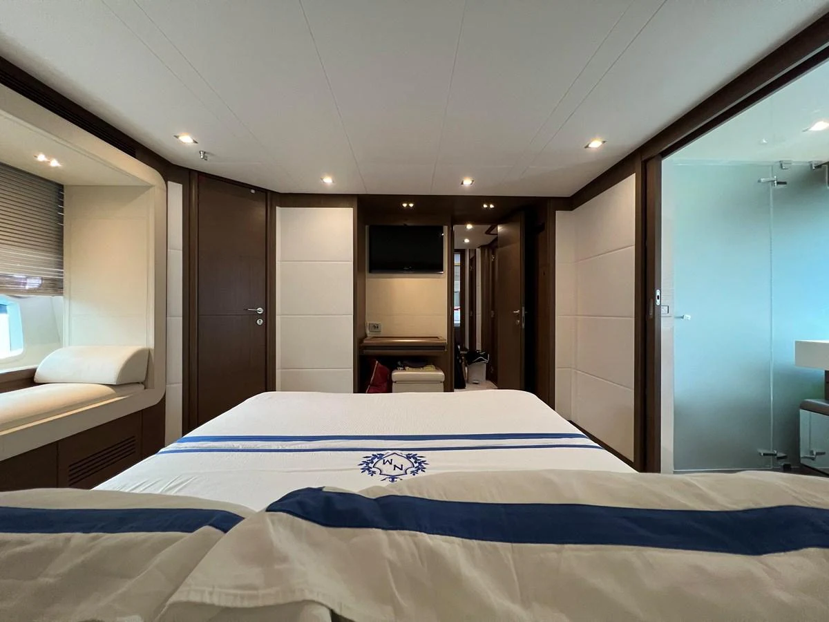 a hotel room with a bed aboard NGV Yacht for Sale